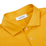 A seasonal Bright Yellow Cotton Filo Scozia polo shirt made of cotton with a label on the collar by Gran Sasso.