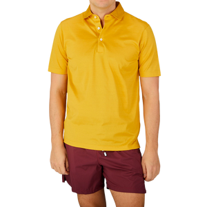 A man wearing a Gran Sasso Bright Yellow Cotton Filo Scozia Polo Shirt.