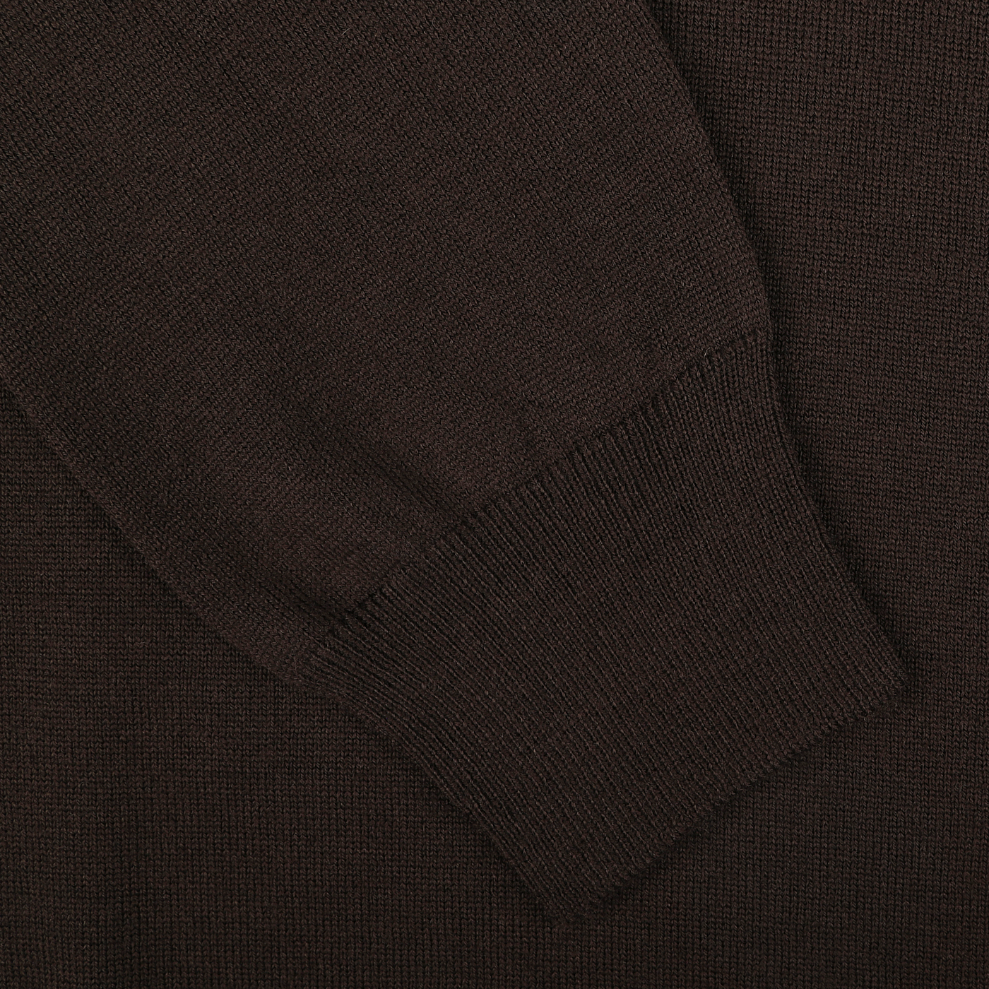 Close-up of the sleeve of a dark brown Extra Fine Merino Roll Neck by Gran Sasso, showing the texture and ribbed cuff.