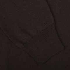 Close-up of the sleeve of a dark brown Extra Fine Merino Roll Neck by Gran Sasso, showing the texture and ribbed cuff.