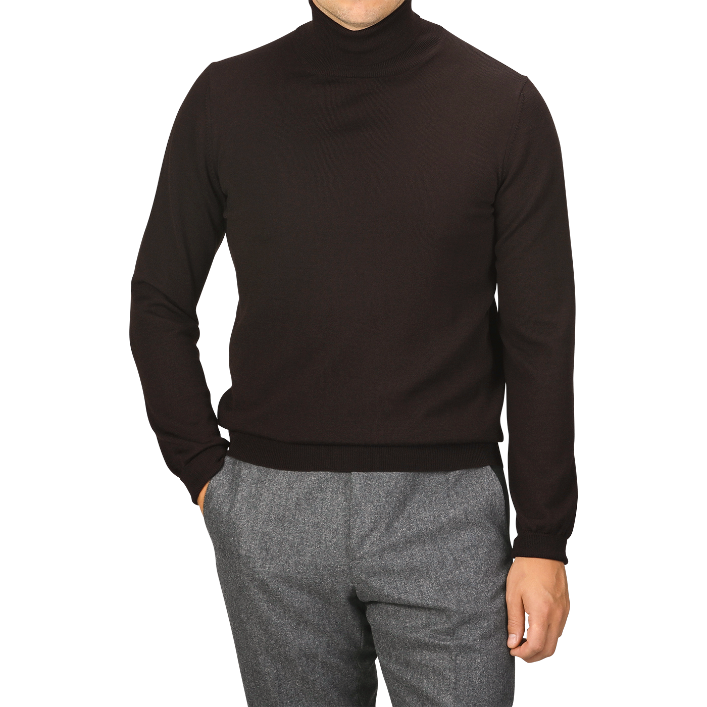 A person is wearing a Gran Sasso Brown Extra Fine Merino Roll Neck sweater and grey pants, with one hand in their pocket. They are facing the camera with squared shoulders, their face not visible.