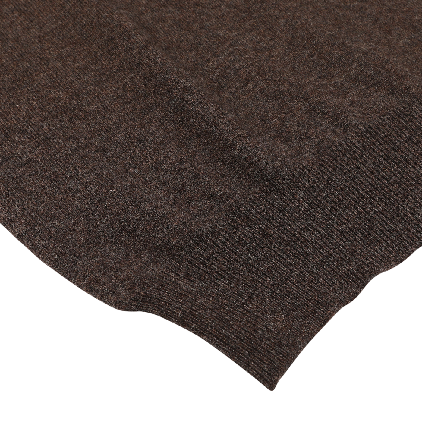 Close-up view of the bottom hem of a Brown Melange Cashmere 1/4 Zip Sweater by Gran Sasso, showcasing its texture and stitching details against a white background.