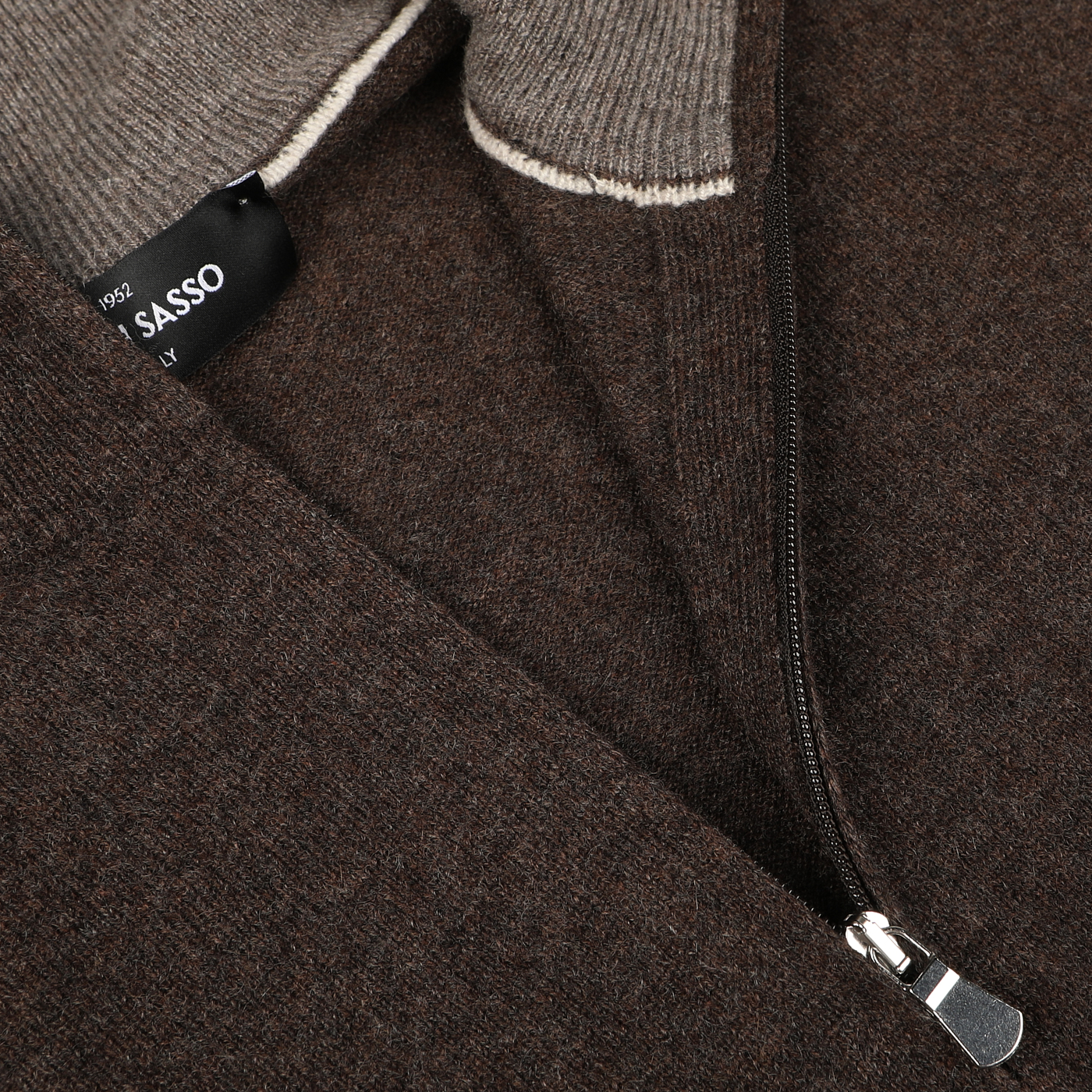 Close-up of the Gran Sasso Brown Melange Cashmere 1/4 Zip Sweater with a partially unzipped zipper, revealing a grey inner lining and a black tag with white text.