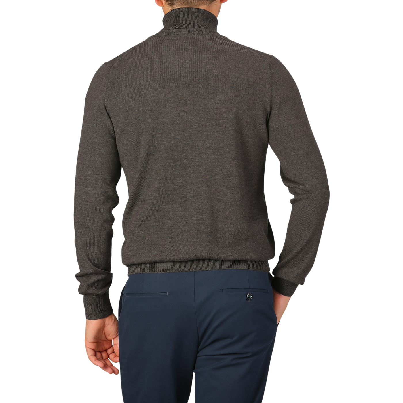 A person is standing with their back to the camera, wearing a Brown Melange Merino Wool Roll Neck sweater by Gran Sasso and navy blue pants.