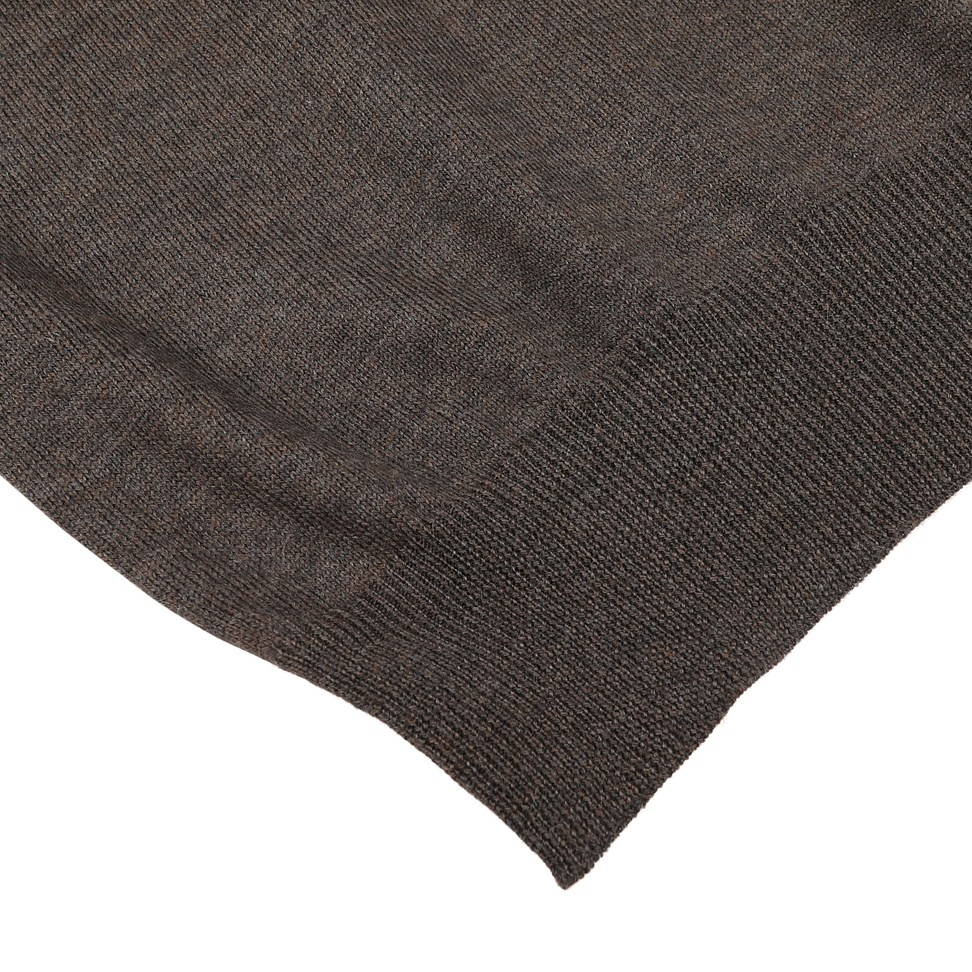 Close-up of the Brown Melange Merino Wool Roll Neck with visible texture and hemmed edge, positioned on a white surface, crafted from fine merino wool by Gran Sasso.