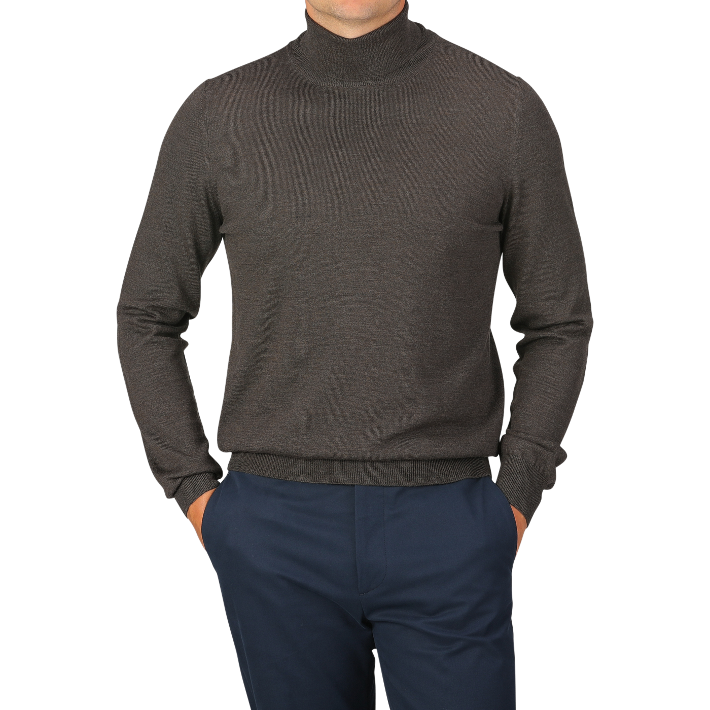 Person wearing a Brown Melange Merino Wool Roll Neck by Gran Sasso and blue pants, posing with hands in pockets against a plain background.