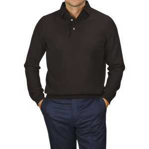 A person with hands in pockets is wearing a Gran Sasso Brown Merino Wool One-Piece Collar Polo Shirt and dark blue pants; the face is not visible.