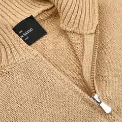 Close-up of a Camel Beige Cotton Boucle Full Zip Cardigan with a silver zipper and a black label reading "Gran Sasso" and "Made in Italy," crafted from luxurious pure cotton boucle.