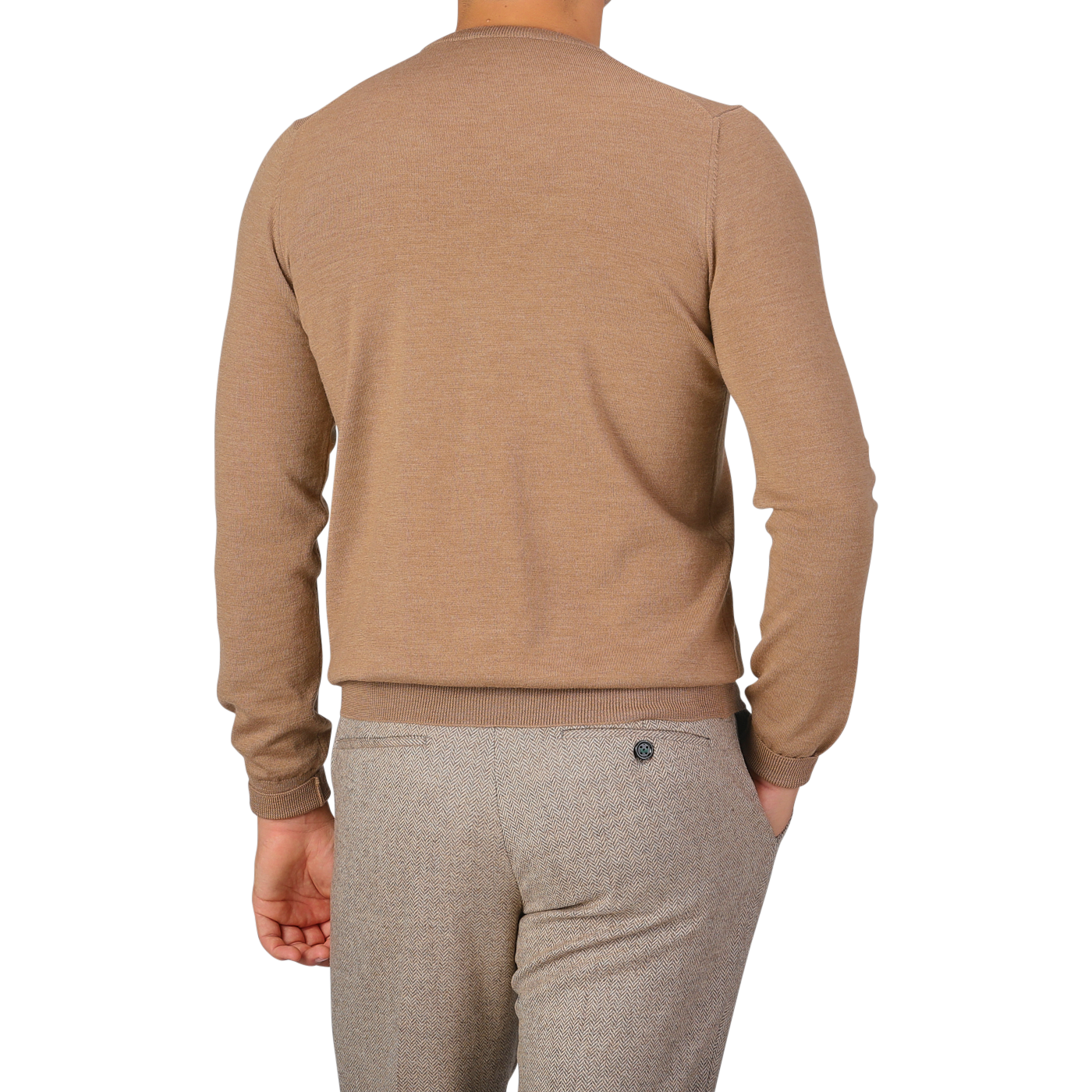 Rear view of a person wearing a Gran Sasso Camel Beige Extra Fine Merino Crew Neck and gray pants, standing against a plain background.