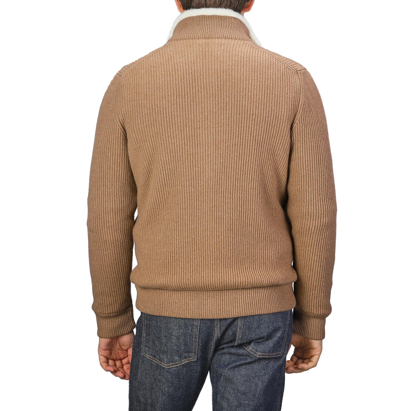 A person is seen from the back wearing a Camel Beige Faux Fur Lined Cashmere Blouson by Gran Sasso with blue jeans.