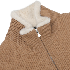 Experience the elegance of luxurious knitwear and classic design with the Camel Beige Faux Fur Lined Cashmere Blouson by Gran Sasso, featuring a high collar lined with cream faux fur.