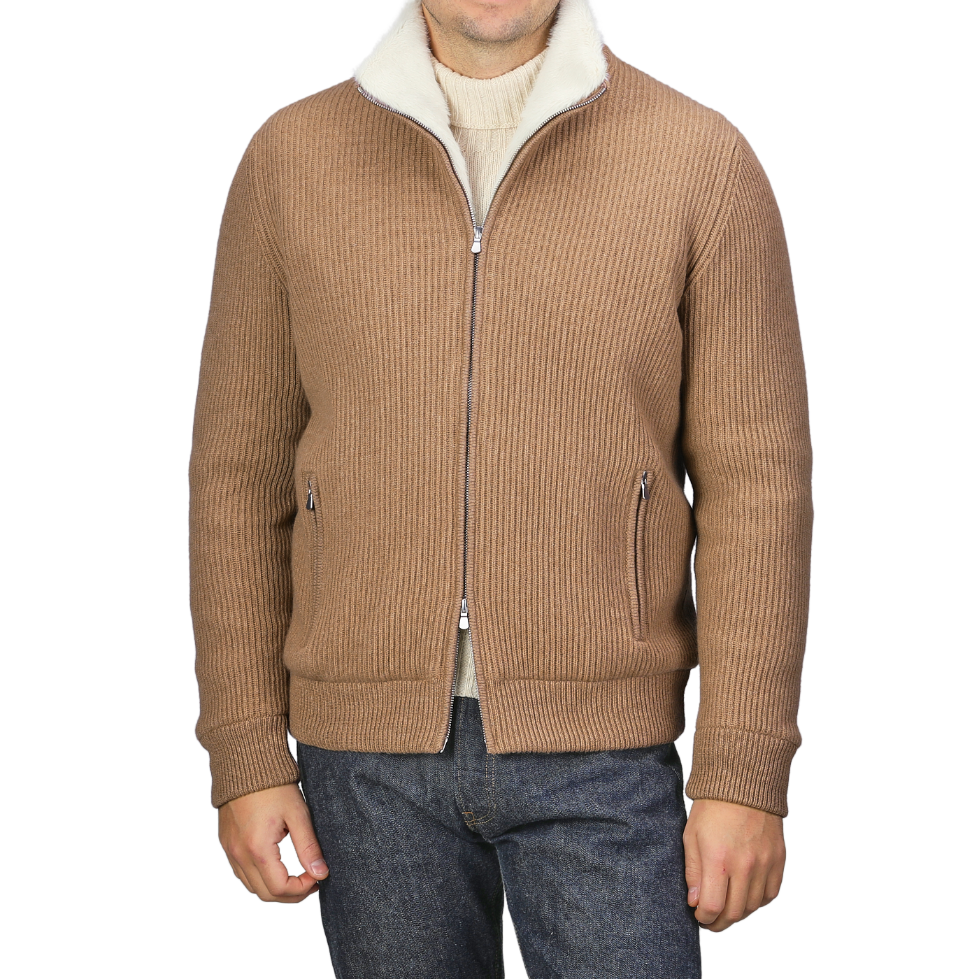 Dressed in a chic and refined knitwear ensemble, the individual is sporting Gran Sasso's Camel Beige Faux Fur Lined Cashmere Blouson over a cream turtleneck, complemented by dark jeans. The head remains out of view.