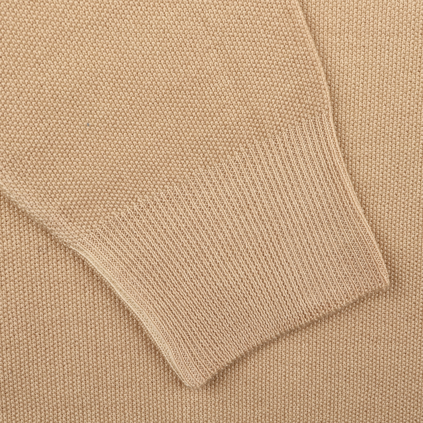 Close-up of a Gran Sasso Camel Beige Vintage Wool Zip Cardigan sleeve, highlighting the knit texture of the wool and its ribbed cuff.