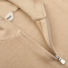 Close-up of the Camel Beige Vintage Wool Zip Cardigan by Gran Sasso, featuring a visible zipper and branded tag inside, crafted from virgin wool for a vintage touch.