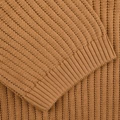 Close-up of the Gran Sasso Camel Brown Organic Cotton Polo Shirt, highlighting its texture and sleeve details.