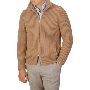 A person wearing a Gran Sasso Camel Wool Cashmere Heavy Knit Cardigan in camel beige over a light blue button-up shirt and beige trousers. The person's head is not visible in the image.