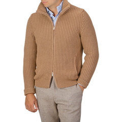 A person wearing a Gran Sasso Camel Wool Cashmere Heavy Knit Cardigan in camel beige over a light blue button-up shirt and beige trousers. The person's head is not visible in the image.