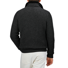 A person wearing a Gran Sasso Charcoal Faux Fur Lined Cashmere Blouson and light-colored pants, viewed from the back against a plain background.