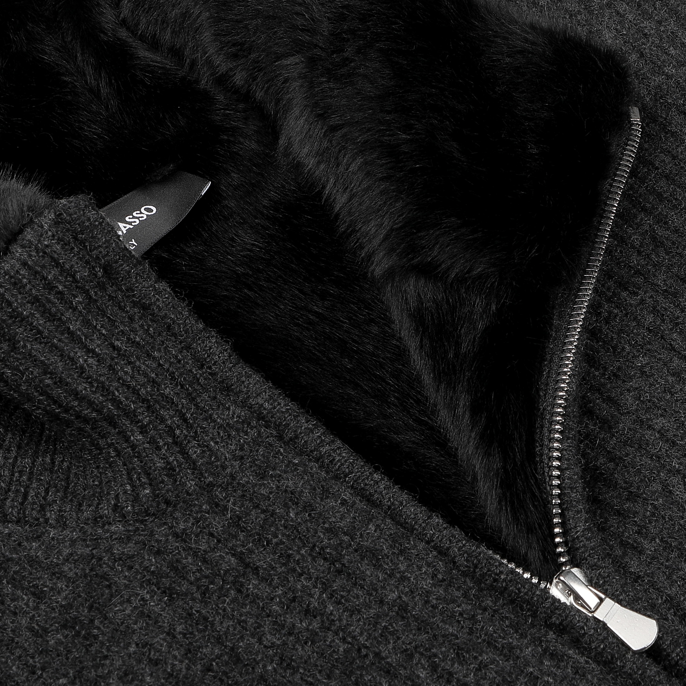 Close-up of the Charcoal Faux Fur Lined Cashmere Blouson by Gran Sasso, showcasing a visible zipper and soft fur lining peeking out, offering a touch of elegance reminiscent of fine knitwear.