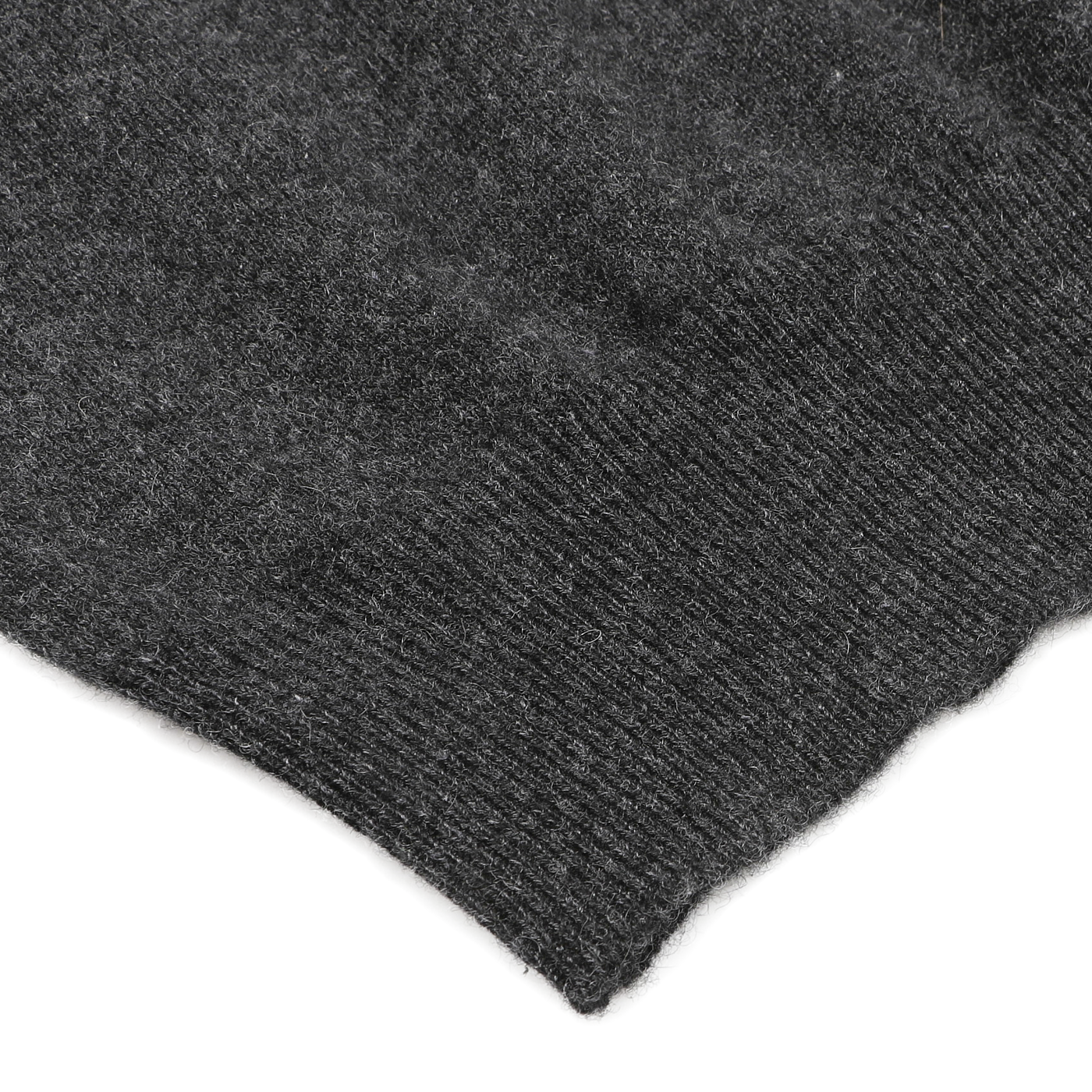 Close-up of the Charcoal Grey Cashmere V-Neck Sweater by Gran Sasso, highlighting the luxurious ribbed texture of its woolen fabric against a light background. This elegant knit detail showcases the exceptional craftsmanship and sustainable quality found in pure cashmere fibers.