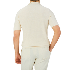 The back view of a man wearing a Gran Sasso Cream Beige Cotton Linen Polo Shirt.