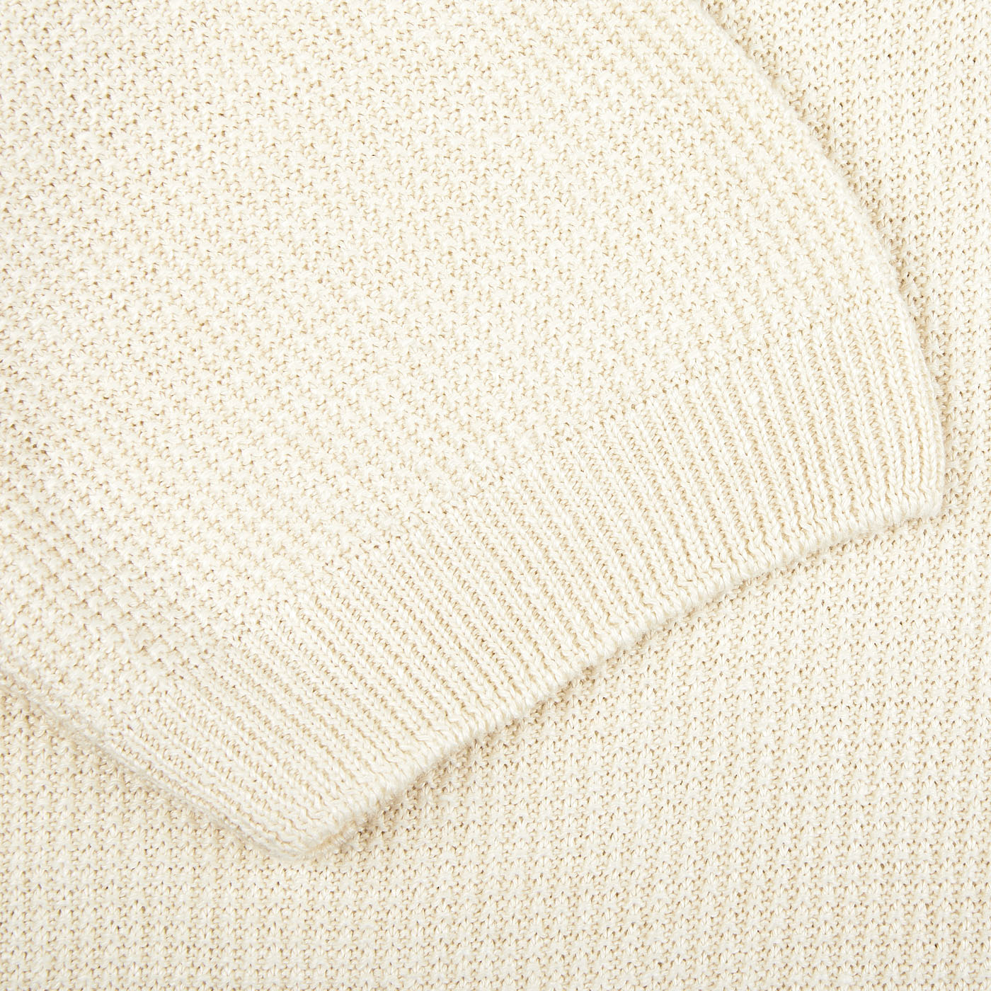 A close up image of a Cream Beige Cotton Linen Polo Shirt made with Gran Sasso thread.