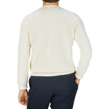 The back view of a man wearing a Gran Sasso Cream Beige Egyptian Cotton Crewneck Sweater.