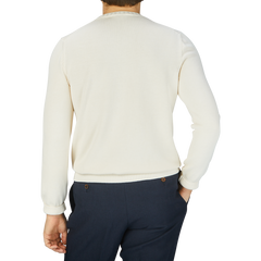 The back view of a man wearing a Gran Sasso Cream Beige Egyptian Cotton Crewneck Sweater.