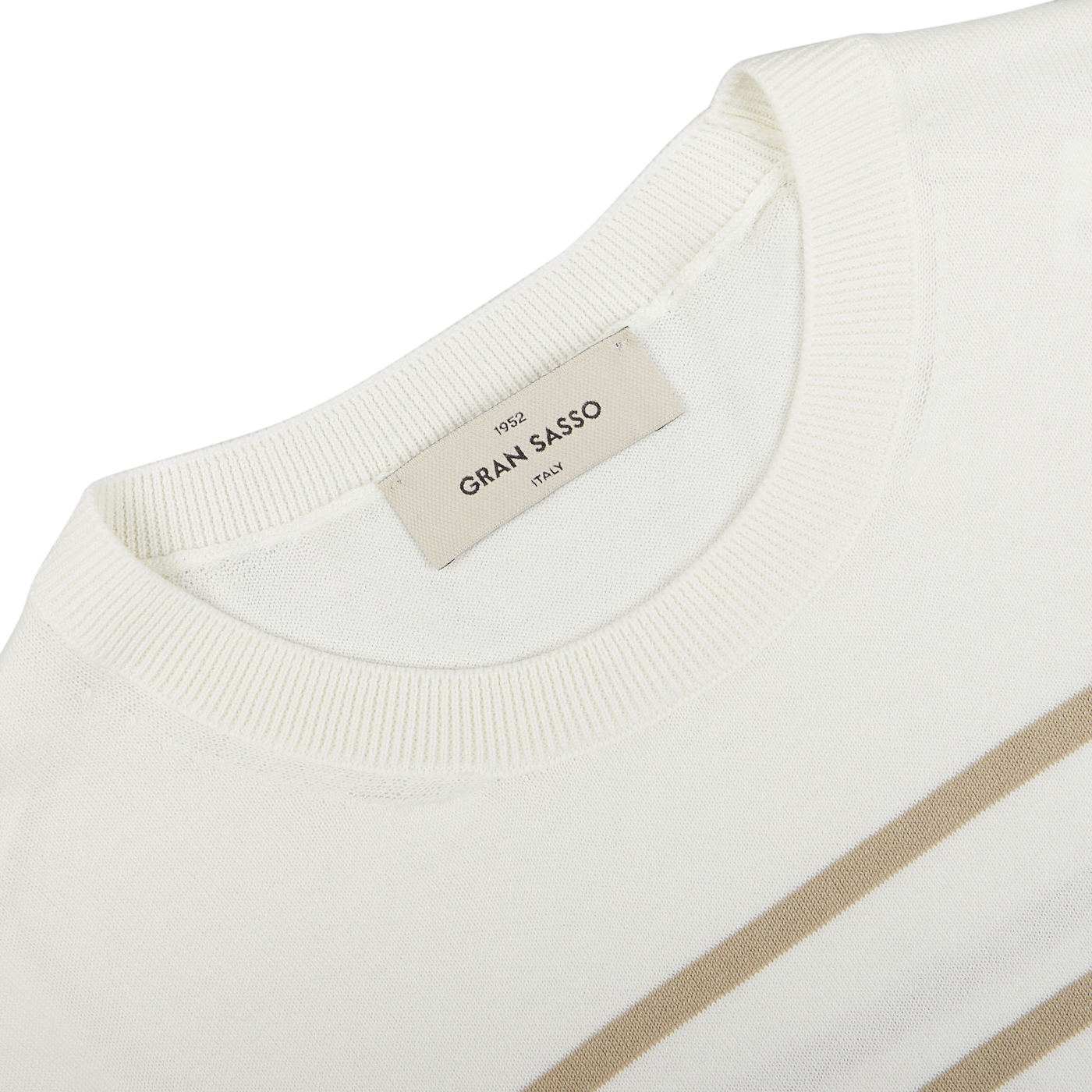Close-up of a cream beige striped organic cotton t-shirt with a Gran Sasso neck label displaying the brand "gran sasso" and size "xxl".