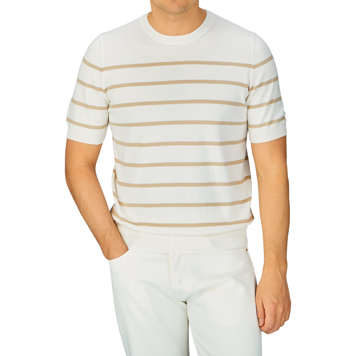 Man wearing a Cream Beige Striped Organic Cotton T-Shirt from Gran Sasso with white pants.