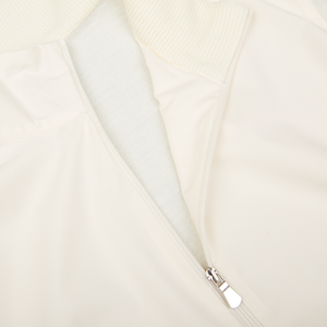 A close up of a Cream Beige Travel Wool Hybrid Jacket from Gran Sasso with zippers.
