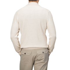 A man wearing a Gran Sasso Cream Cotton Linen LS Polo Shirt and khaki pants is facing away.