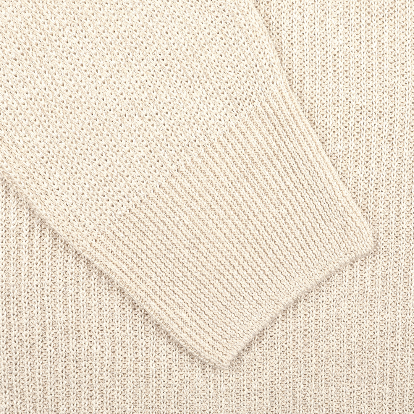 Close-up of a slim fit cream cotton linen polo shirt by Gran Sasso, highlighting detailed ribbed cuffs and textured fabric, reminiscent of elegance.