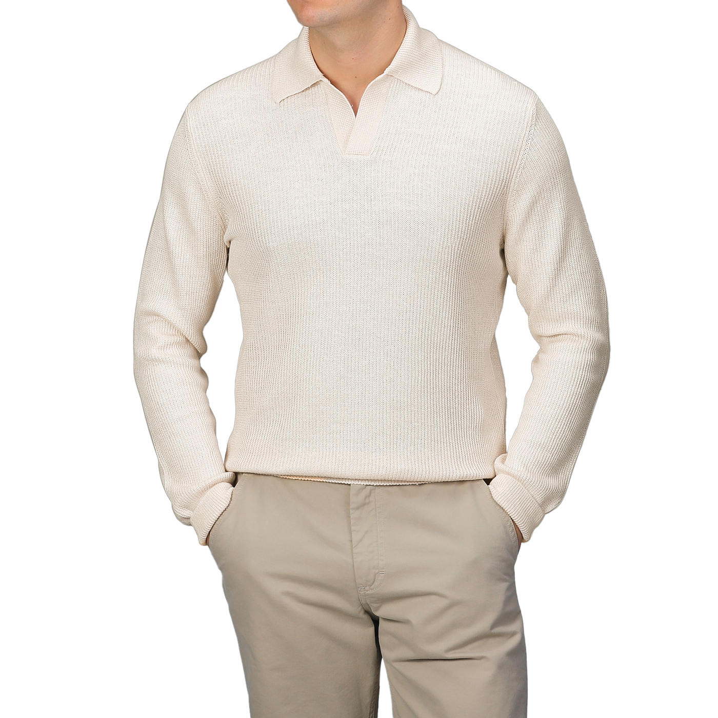 A person wears a slim fit Cream Cotton Linen LS Polo Shirt by Gran Sasso, paired with beige pants, hands casually tucked in pockets against a gray backdrop.