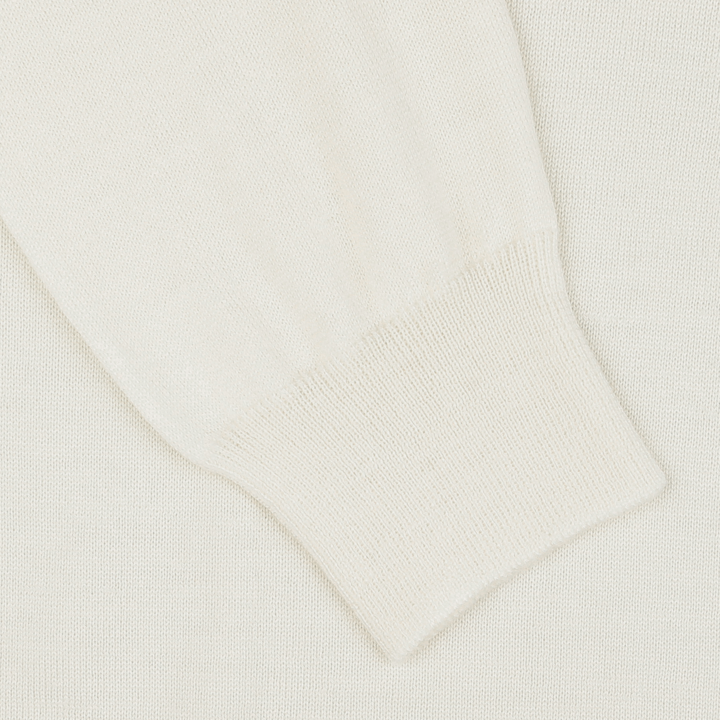 Close-up of a Cream Extra Fine Merino Crew Neck sleeve with ribbed cuffs, showcasing its premium quality—a versatile piece from Gran Sasso for any multiple-purpose wardrobe.