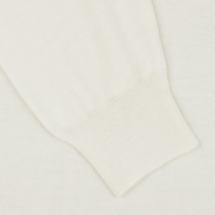 Close-up of a Cream Extra Fine Merino Crew Neck sleeve with ribbed cuffs, showcasing its premium quality—a versatile piece from Gran Sasso for any multiple-purpose wardrobe.