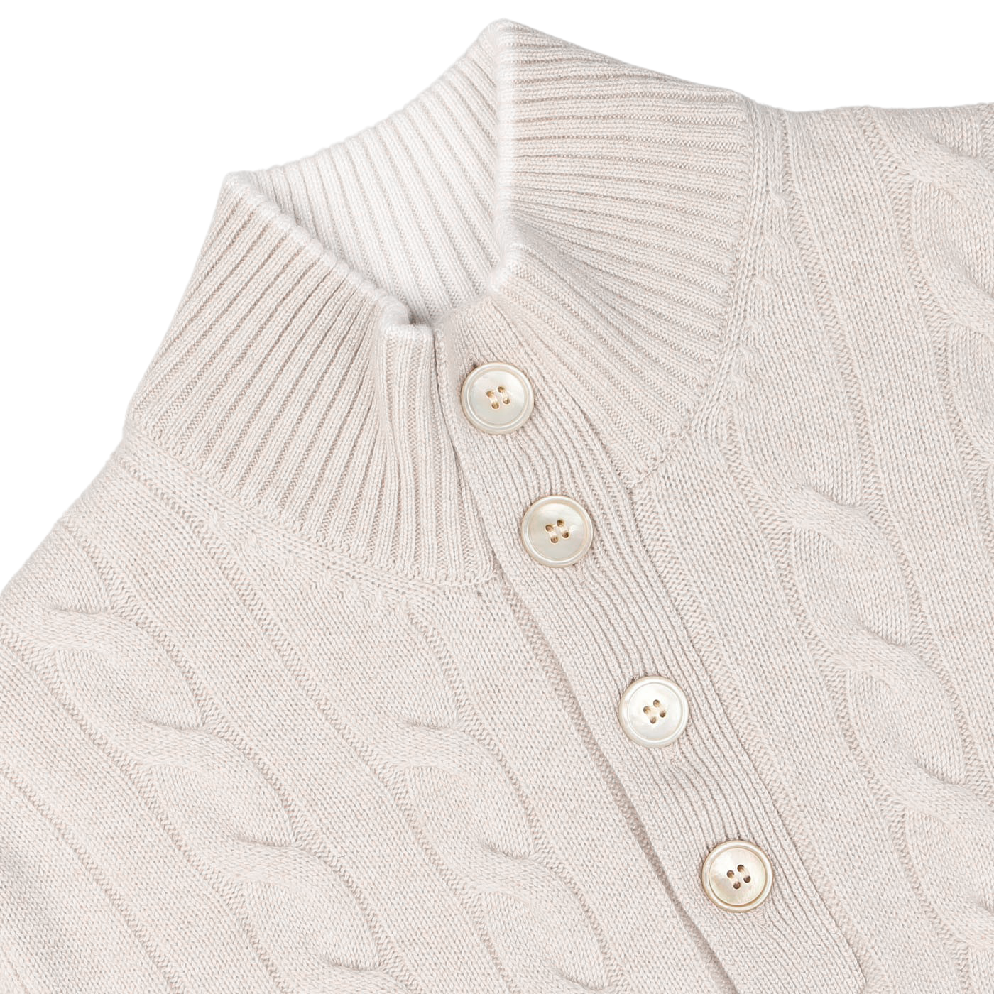 Close-up of a cream pure cashmere quarter button sweater featuring a cable-knit design, high ribbed collar, and three vertically aligned beige buttons in the front. Crafted with impeccable care, this Gran Sasso creation exudes timeless elegance.