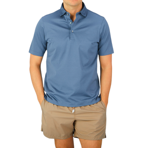 A man wearing a Dark Blue Cotton Filo Scozia Polo Shirt by Gran Sasso.