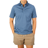 A man wearing a Dark Blue Cotton Filo Scozia Polo Shirt by Gran Sasso.