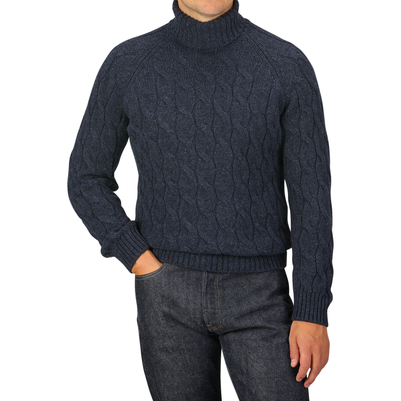 A person is wearing a dark blue Gran Sasso Wool Cable Knit Rollneck sweater, made from pure virgin wool, and dark jeans, posing with one hand in their pocket.