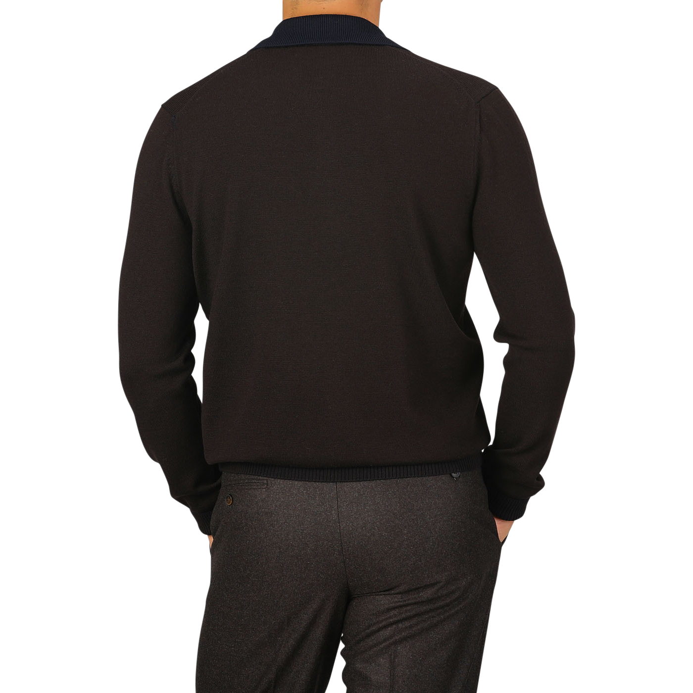 A person wearing a Dark Brown Extra Fine Merino LS Polo Shirt from Gran Sasso and gray pants is shown from the back with their hands in their pockets.