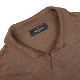 A close up of a Dark Brown Knitted Silk Polo Shirt from Gran Sasso with a cooling effect.