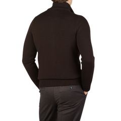 The back view of a man wearing a Dark Brown Merino Wool Button Cardigan made by Gran Sasso.