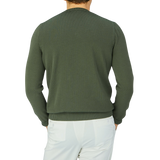 The back view of a man wearing a Gran Sasso Dark Green Egyptian Cotton Crewneck Sweater.