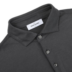 A folded Dark Grey Washed Cotton Popover Shirt by Gran Sasso showcases its label, made from pure cotton in a button-up style.