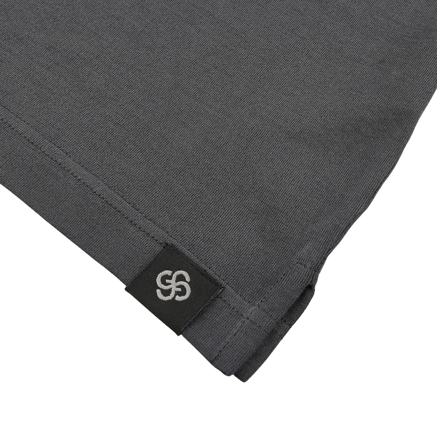 Close-up of Gran Sasso's Dark Grey Washed Cotton Popover Shirt, featuring pure cotton jersey and a black label with a white overlapping design sewn into the hem.