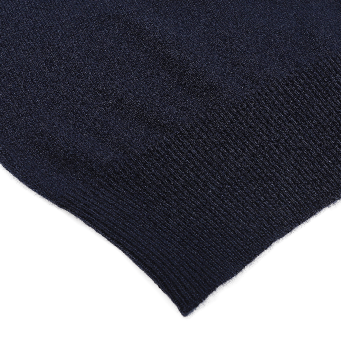 A close-up of the ribbed edge on the Dark Navy Cashmere Crewneck Sweater by Gran Sasso showcases sustainable knitwear at its finest.