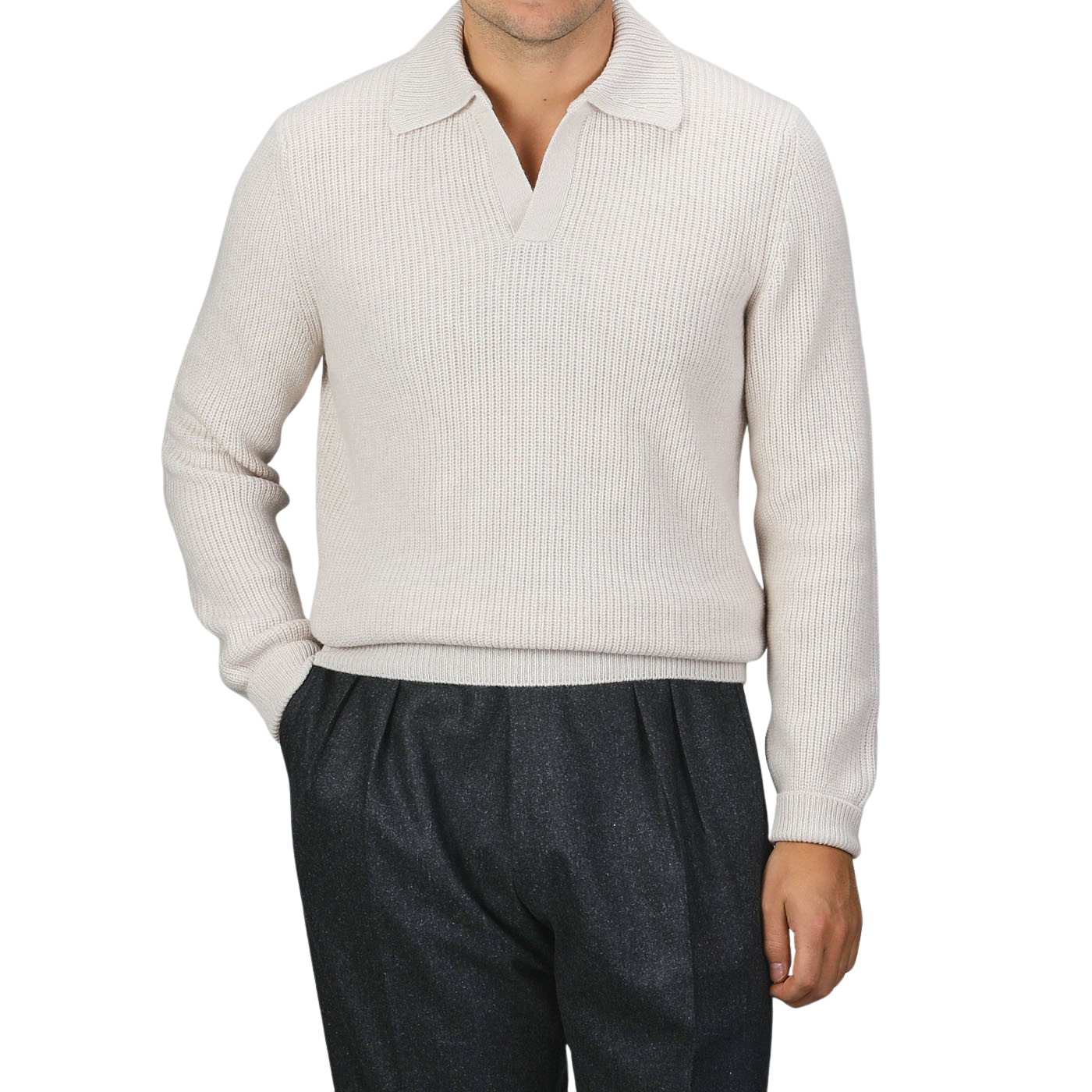 A person is wearing an Ecru Beige Chunky Knit Wool Polo Shirt by Gran Sasso, paired with dark gray pants. The background is plain gray.