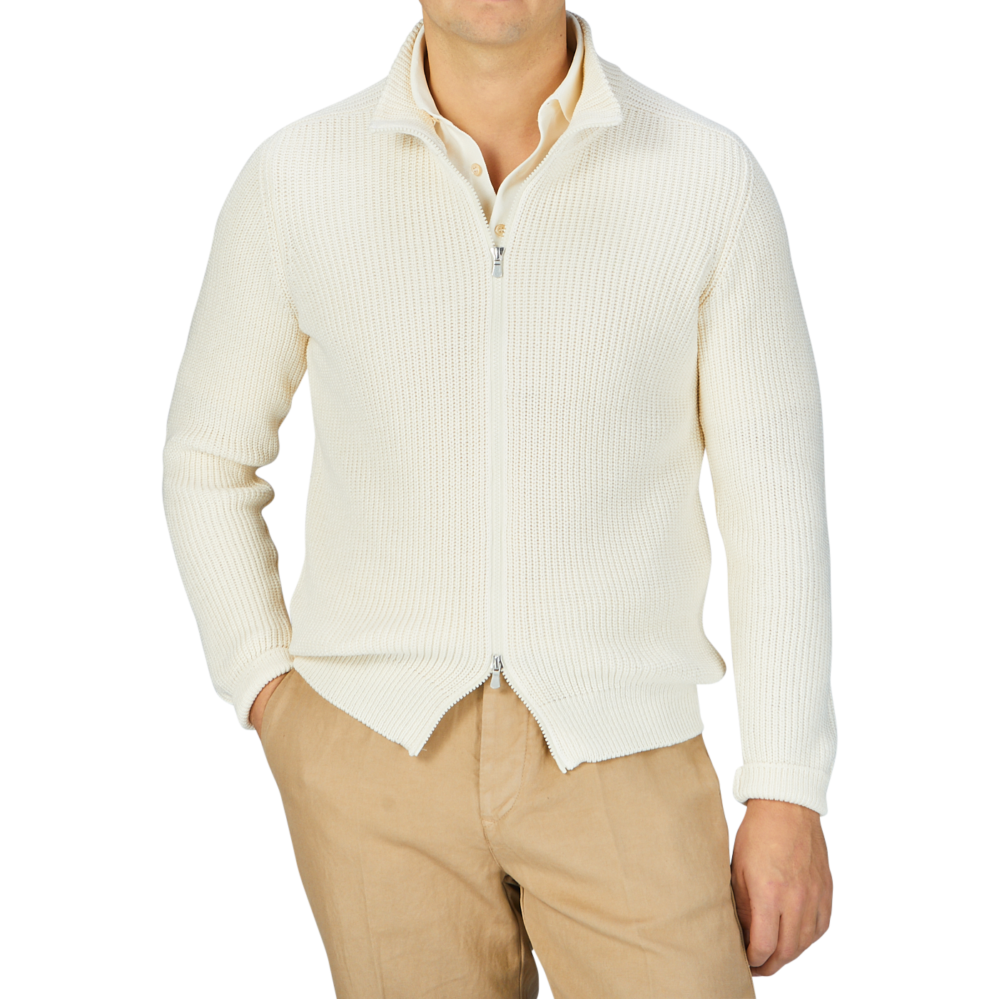 A man wearing a Gran Sasso Ecru Rib Stitch Cotton Full-Zip Cardigan and tan cotton pants.