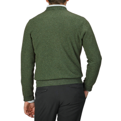 A person is shown from the back wearing a Green Felted Cashmere Crewneck Sweater by Gran Sasso, paired with black pants.